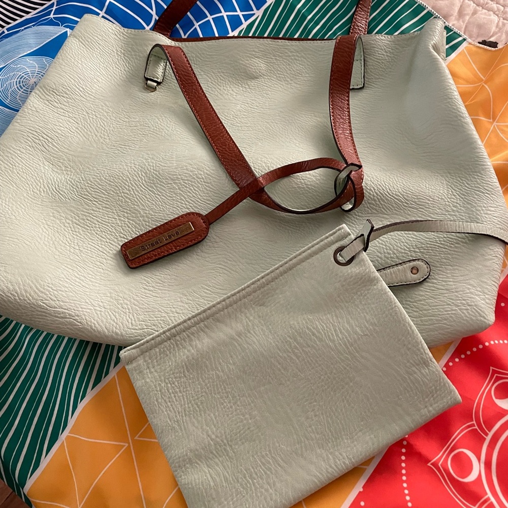 Street Level reversible faux leather tote and Wristlet. Never used